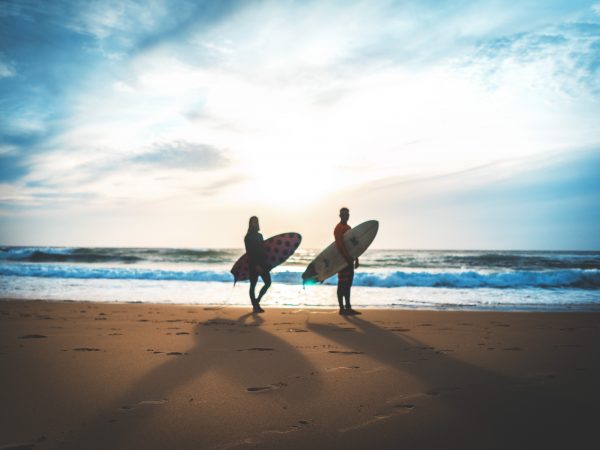Two people surfing